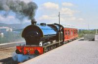 The Strathspey Railway's Austerity No 60 with their LMS inspection saloon alongside the Aviemore 'Speyside' platform on 15 May 1981. The train is conveying Railway Officers and Railway Inspectorate Staff. <br><br>[Peter Todd 15/05/1981]