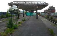 Without the DMU standing at platform 2 this could easily be mistaken for a disused station, rather than the run down Wakefield Kirkgate in the early stages of refurbishment. Since the shot was taken the all over canopy at the out of bounds east end, plus most of that along platform 3 to the left, has been removed. This work was completed prior to demolition of a large part of the spine wall that once supported the overall station roof. [See image 34147]<br><br>[David Pesterfield 28/05/2012]