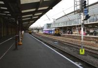 Looking north along the former RES platform at Preston station on 21 July 2012 as a pair of Class 150s waits with the Open Golf championship special to Ansdell & Fairhaven. Over on the right on platform 1 a Class 153 prepares to depart with the Preston to Ormskirk shuttle service.<br><br>[John McIntyre 21/07/2012]