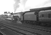 The 11.50am Glasgow Central - Morecambe stands at Carlisle platform 3 on a summer Saturday in August 1963. Crewe North 'Coronation' Pacific no 46248 <I>City of Leeds</I> is about to take the train south.<br><br>[K A Gray 17/08/1963]