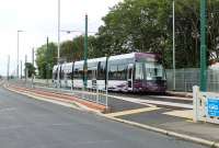 1960s railway enthusiasts would have alighted here to <I>bunk</I> Fleetwood Shed (Code 24F/10C) which was immediately behind the trees but now lies under industrial units and a new road system. Tram 003 heads towards Blackpool without stopping during a driver training run on 31 July 2012. The well designed arrangements at the new tram stops can be seen in this view. <br><br>[Mark Bartlett 31/07/2012]