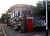 This rather splendid 1930's signal box would not look out of place in South West London - Wimbledon, for example [see image 9428]. It is still used, and has been updated with double glazing - no mean feat with those curved window spaces. A spur from the Somerset and Dorset ran up to the platform on the right, now bounded by trees.<br><br>[Ken Strachan 28/07/2012]