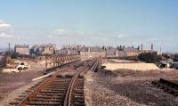 A temporary bridge carries the Coltbridge Junction-Leith North goods line across Ferry Road at Crewe Toll prior to the installation of a 'permanent' new girder bridge being swung into position. This view was taken in spring 1966, and just over a year later the line closed completely! The bridge however survived for many more years until it was eventually replaced by a new cycle path bridge (presumably providing higher clearances for buses and lorries]. [See image 29633]<br><br>[Frank Spaven Collection (Courtesy David Spaven) //1966]