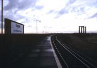 Looking north towards the Isle of Sheppey and Sheerness over the vertical lift Kingsferry Bridge from the platform at Swale station on an October evening in 1989.<br><br>[Ian Dinmore /10/1989]