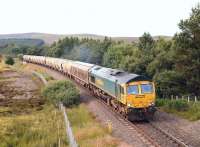 The Inverness - Oxwellmains cement empties heading south near Tomatin on 2 August behind Freightliner 66614.<br><br>[John Gray 02/08/2012]