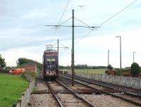 Looking towards Cleveleys and Blackpool from the level crossing at Broadwater as rebuilt Balloon car 707 departs for Starr Gate. The tram stop at this time was behind the camera but moved during the refurbishment. [See image 39822] for the same location three years later<br><br>[Mark Bartlett 10/06/2009]