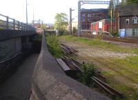 A view showing the divergence of the Bollington line from the current main line to Manchester Piccadilly [see image 39173]. The next section snaked around behind the town gasworks on a steel viaduct over the River Bollin; which I can remember being cut up in the 1970's.<br><br>[Ken Strachan 12/05/2012]