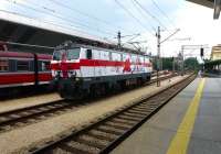 One of the PKP locomotives painted in the national colours of the 16 teams competing in the UEFA 'EURO 2012' football championships, hosted jointly by Poland and Ukraine. EP 09 034, sporting England colours, was photographed on 25 July running light engine through Krakow Glowny station.<br><br>[Colin Miller 25/07/2012]