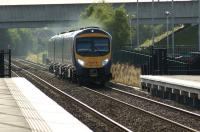 Approaching Buckshaw Parkway station on 4 August 2012, First TransPennine 185145 heads for Manchester Airport.<br><br>[John McIntyre 04/08/2012]