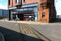 The Andrew Barclay Caledonia Works in August 2012, now redeveloped with the main building refurbished. To the rear is a new complex of flats. In the old entry there is a Barclay on the original track which has been retained just inside the building. The loco is just visible to the left of all the posters. [See image 28178]<br><br>[Colin Miller /08/2012]