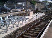 Tata Steel is assembling a new extension to the former down platform at Templecombe, with work in progress seen here on 28 July. Notice the goods shed, now in industrial use; and the (currently closed) barrow crossing at the end of the platform.<br><br>[Ken Strachan 28/07/2012]