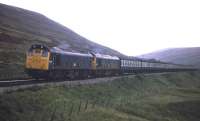 Unusually, a Class 25 heads this Inverness-bound train up the last leg to Druimuachdar Summit in 1977.<br><br>[Frank Spaven Collection (Courtesy David Spaven) //1977]