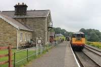 EE Type 1 20166 pulls in to Redmire station with a Wensleydale Railway service that originated at Leyburn and will now form the first departure, the 10.10hrs to Leeming Bar. The station building has been extended (or should that be restored) in recent years and now appears to be used as holiday acocmmodation or a hostel. [See image 37234] for an earlier view of the same location.<br><br>[Mark Bartlett 12/08/2012]