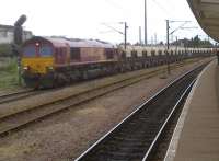 66142 gives a wide berth to platform 5 as it heads south through Peterborough with the Lafarge self-unloading aggregates train on 2nd August 2012.<br><br>[Ken Strachan 02/08/2012]