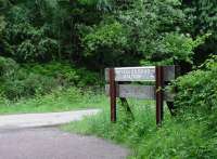 Drybrook Road station was in the middle of the forest where the Mineral Loop joined the Severn and Wye Main Line. It was two miles from Drybook and not even on a metalled road! The station closed to passengers in 1929. This sign, photographed in June 2002, was erected when the trackbed was made into a cycle path.<br>
<br><br>[John Thorn 12/06/2002]