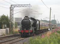 <I>The Great Marquess</I> was used for the <I>The Fellsman</I> service for a third consecutive week on 15th August. 61994 is seen here at the site of Brock station on the outward leg of the journey and is just passing over the only remaining foot crossing between Lancaster and Preston.<br><br>[Mark Bartlett 15/08/2012]