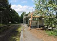 A bit of TLC being applied to the signalbox at Knockando in July 2012. The station building, behind the camera, has already been renovated [See image 39004]. View west towards Blacksboat.<br><br>[Mark Bartlett 05/07/2012]