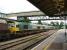 Freightliner 66560, with 66601 dead in train, waiting at signals at the south end of Hereford Station on 16 July 2012. Up ahead the 12.49 ex Birmingham New Street via Great Malvern is crossing over prior to running back into platform 3 ready for its return to Birmingham.<br><br>[David Pesterfield 16/07/2012]
