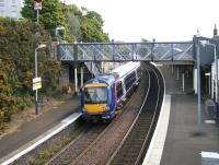 A northbound Fife circle train calls at Burntisland in May 2005. The original Edinburgh and Northern station is off picture to the right.<br><br>[John Furnevel 26/05/2005]