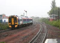 Leaving Larbert Station northbound during a rainstorm in May 2005.<br><br>[John Furnevel /05/2005]