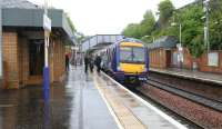 A Glasgow - Edinburgh shuttle calls at Falkirk High on 25 May 2005 during heavy rain.<br><br>[John Furnevel 25/05/2005]