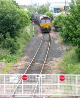 Train of empty coal hoppers for Leith Docks held at Seafield level crossing -  9 June 2005. Note the new LC gates [see image 3381].<br><br>[John Furnevel 09/06/2005]