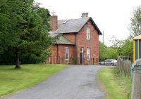 Looking along the approach to the former Greenlaw station in June 2005. The station, originally opened by the Berwickshire Railway in 1863, lost its passenger service in 1948 and has long been a private residence.  <br><br>[John Furnevel /06/2005]