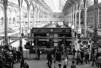 Looking over the concourse and passenger information board located between platforms 15 and 16 at Liverpool Street station in October 1976.<br><br>[John Furnevel 23/10/1976]