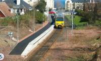 The next service to Edinburgh Waverley awaits its departure time from North Berwick on 12 April 2002. The train is formed by ScotRail EMU 322484.<br><br>[John Furnevel 12/04/2002]