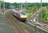 A class 90 hauled train from North Berwick passing Portobello Junction on 17 June 2004 on its way to Waverley, with a DVT bringing up the rear.<br><br>[John Furnevel 17/06/2004]