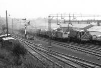 A Clayton takes a freight north through Motherwell on the WCML in October 1970. The train has just passed through the station and is about to pass the Motherwell Bridge works. <br><br>[John Furnevel 30/10/1970]