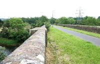 The former Waverley railway bridge across the Tweed on the east side of Galashiels looking towards Tweedbank in June 2005.<br><br>[John Furnevel /06/2005]