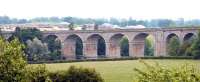 Wide view of Roxburgh Viaduct over the River Teviot looking southeast in June 2005. Note the housing developments in the background and the low level pedestrian footbridge attached to the piers. [See image 45944]  <br><br>[John Furnevel /06/2005]