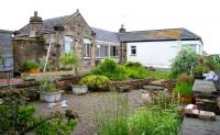 The former Crail station in June 2005, following part demolition, part conversion and part extension to form a garden centre - view is south between the platforms.<br><br>[John Furnevel 24/06/2005]