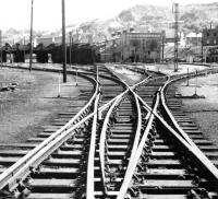 Looking south towards the closed Perth shed in 1970, with the shed clock still in place and a number of the former stabling roads being used to store lifted track.<br><br>[John Furnevel 25/05/1970]