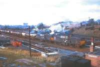 A pair of Claytons passing Kingmoor with a freight on 1 April 1967. This was the occasion of the A4 Preservation Society <I>'Inaugural run of Sir Nigel Gresley'</I> railtour from Crewe. 4498 can be seen on Kingmoor shed in the background with one or two photographers in attendance.<br><br>[Bruce McCartney 01/04/1967]