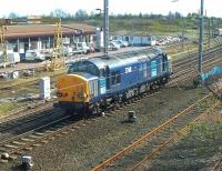 DRS 37611 ambles back from Powderhall to Millerhill yard in December 2002 following 'Binliner' duties. <br><br>[John Furnevel 10/12/2002]