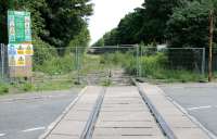 Scene at Alloa West level crossing looking east on 2 June 2005, with barriers erected and one or two site safety notices now in place.<br><br>[John Furnevel 02/06/2005]