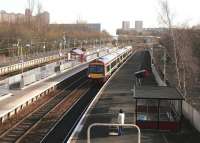 A DMU from Cumbernauld arrives at Springburn on 19 February 2005, with one passenger waiting to board for the short journey to Queen Street High Level.<br><br>[John Furnevel 19/02/2005]