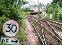 A Glasgow bound train coming off the Milngavie branch at Milngavie Junction on 30 July 2005, photographed from the end of the platform at Westerton station.<br><br>[John Furnevel 30/07/2005]