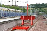 The bay platform recently completed and soon to be brought into use at Anniesland to handle trains arriving from Queen Street High Level via the new link from Maryhill Park Junction. The link is isolated from the main through route on the left where a Milngavie - Lanark train has recently arrived.<br><br>[John Furnevel 10/07/2005]