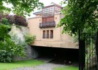 Rear view of the restored former Kelvinside station on Great Western Road on 10 July 2005, here called the <I>Lux/Stazione</I> bar and restaurant. Note the sections of both platforms still in place below the building. Kelvinside station was closed to passenger traffic in July 1942.<br><br>[John Furnevel 10/07/2005]