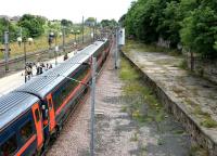 Looking north over the old bay at Berwick with a southbound train stopped in the main platform - July 2005.<br><br>[John Furnevel 05/07/2005]