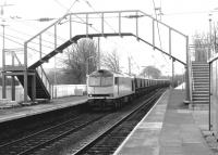 BR Coal Sector liveried 60074 <I>Braeriach</I> with an eastbound coal train crossing over to run 'wrong line' through Slateford station in 1993 in order to access Slateford Junction. From here it will take the 1961 west to south curve to Craiglockhart Junction where it will join the 'sub'. [See image 10257]<br><br>[John Furnevel 17/06/1993]