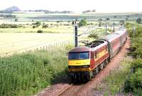 An Edinburgh Waverley - North Berwick train with EWS 90029 at the rear, photographed shortly after leaving the ECML at Drem Junction on 15 July 2005. North Berwick Law stands in the left background.<br><br>[John Furnevel 15/07/2005]