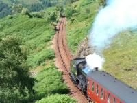 K1 no 62005 <i>Lord of the Isles</i> powers up the 1 in 50 gradient from Glenfinnan Viaduct towards the station in July 2005.<br><br>[John Gray 28/7/2005]