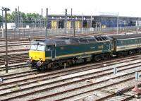 First Great Western <I>Sleeper</I> liveried class 57 locomotive no 57605 <I>Totnes Castle</I> ambles past North Pole 'eurostar' depot in July 2005 with empty stock.<br><br>[John Furnevel 21/07/2005]