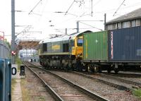 Good places not to have a points failure - No 43 Mitre Bridge Junction. Freightliner 66570, having brought a southbound container train around the spur from Willesden Junction High Level station in July 2005, completes the switch from the North London Line to the West London line at Mitre Bridge Junction, just prior to crossing the Grand Union Canal. <br><br>[John Furnevel 22/07/2005]