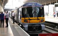 An aggressive looking Heathrow Express stands at Paddington on 20 July 2005, with its <I>minder</I> bearing more than a passing resemblance to Vinnie (<I>mind your head in the door sir</I>) Jones.<br><br>[John Furnevel 20/07/2005]