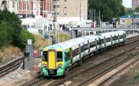 A Southern Trains Brighton - Watford Junction Cross-London service about to call at Kensington Olympia on the West London Line in July 2005.<br><br>[John Furnevel 21/07/2005]